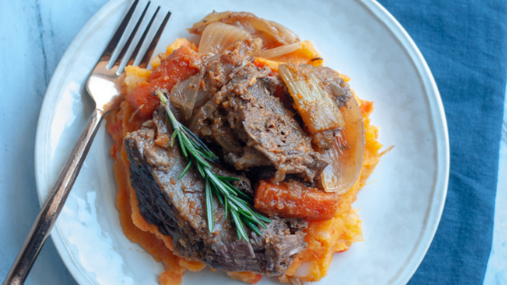 pot roast and sweet potato mash plated on a white plate