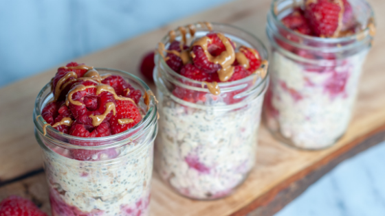 chia seed overnight oats with raspberries on top