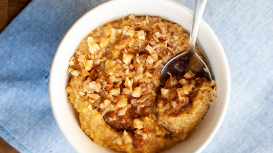 pumpkin oatmeal in a bowl with blue napkin